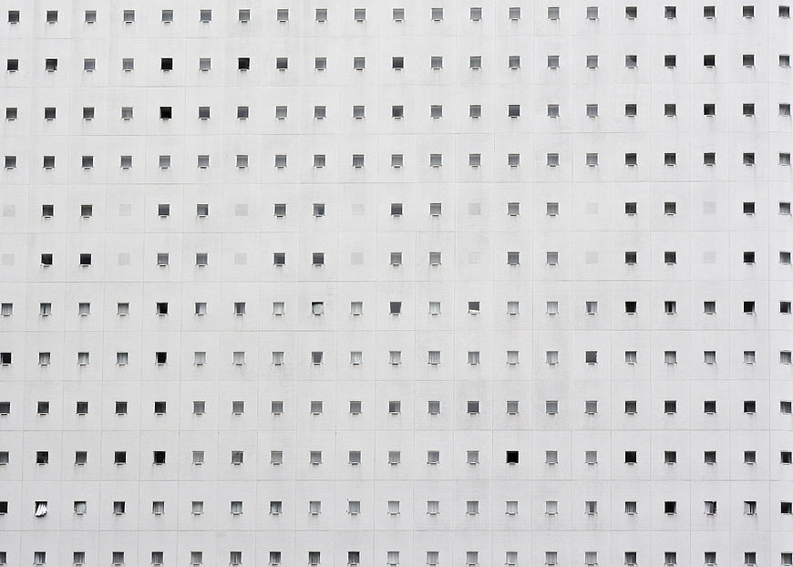 Minimalist White Building Facade with Grid of Square Windows