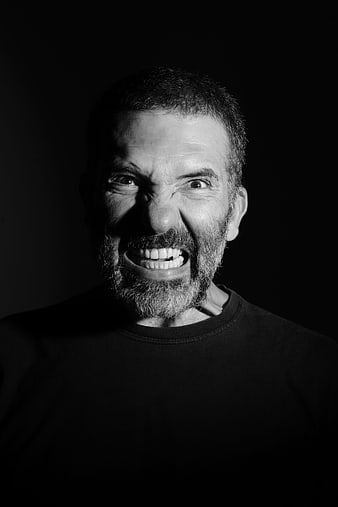 Dramatic Black and White Portrait of Man with Intense Expression