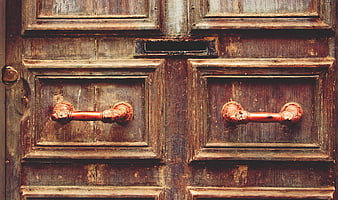 Vintage Wooden Door with Rusty Handles and Mail Slot