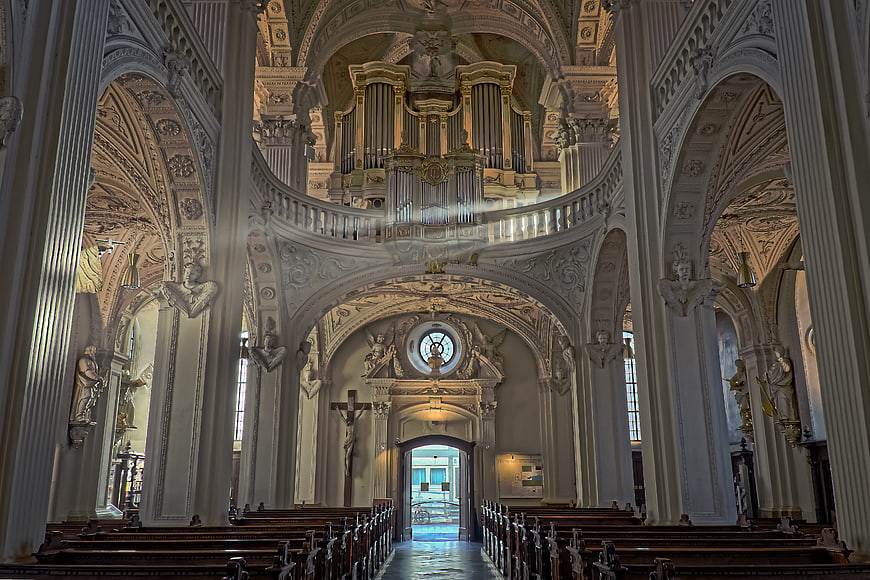 Baroque church interior with organ and columns