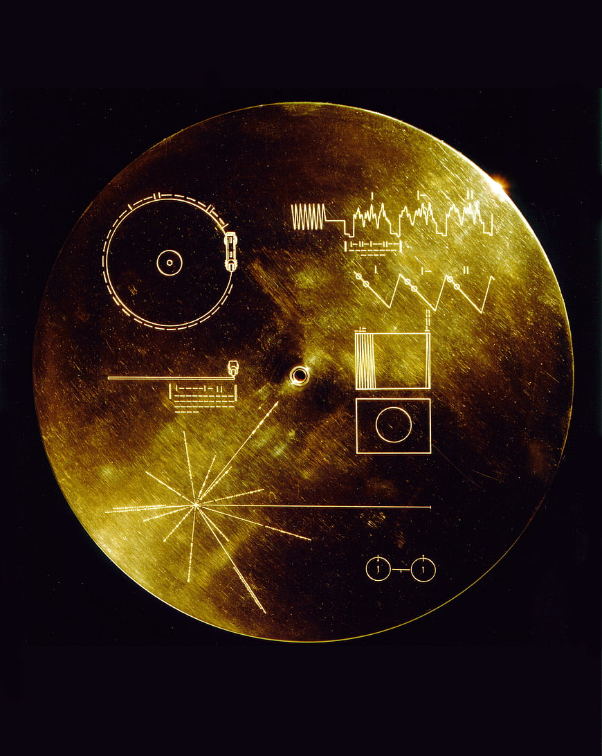 Voyager Golden Record with Etched Diagrams on Black Background
