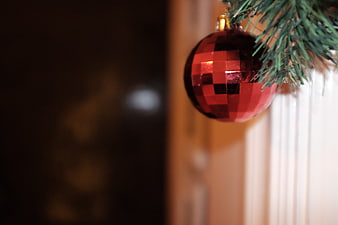Red Faceted Christmas Bauble on Pine Branch