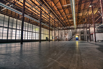 Spacious Empty Industrial Warehouse Interior with High Ceilings