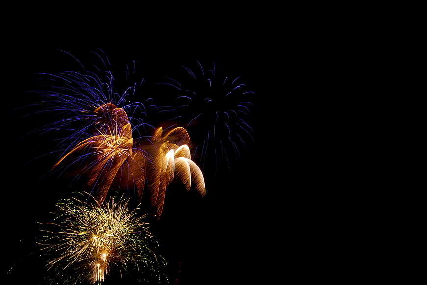 Colorful Fireworks Display Against Black Night Sky