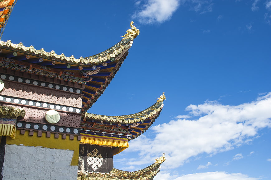 Traditional Tibetan Temple Roof Against Blue Sky