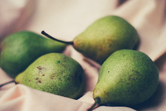 Fresh Green Pears on Soft Fabric Background