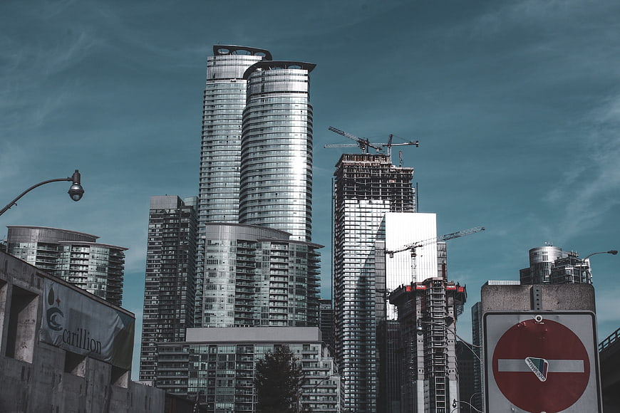 Modern Skyscrapers and Construction Cranes in Urban Cityscape