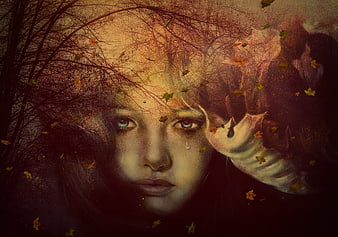 Surreal portrait of a weeping woman with autumn leaves and trees