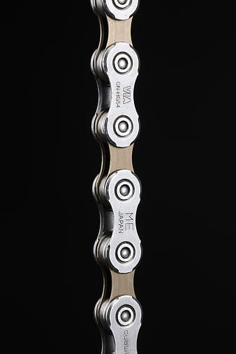 Close-up of Shimano bicycle chain on black background
