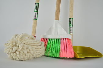 Colorful Broom, Mop, and Dustpan on White Background