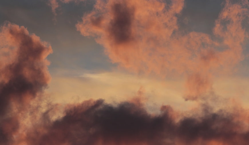 Dramatic Dawn Sky With Pink And Dark Clouds