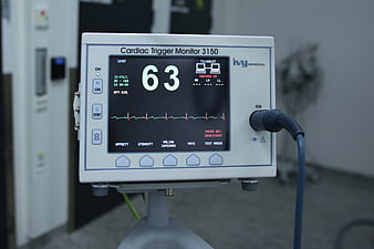 Cardiac Trigger Monitor 3150 displaying heart rate 63 in hospital setting