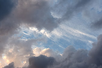 Dramatic Clouds and Blue Sky with Sunlight Breaking Through
