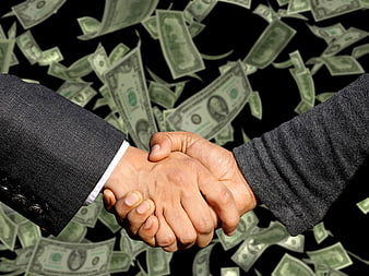 Business handshake with falling money background