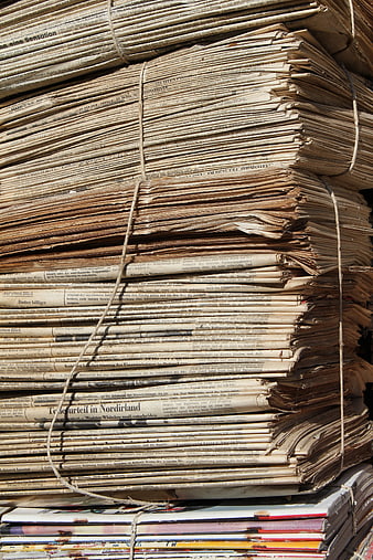 Stack of Old Yellowed Newspapers Tied with Twine