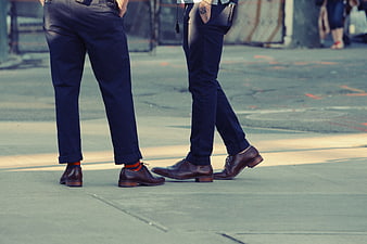 Men's Fashion: Brown Leather Shoes and Navy Pants on City Street