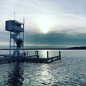 Solitary Watchtower on Wooden Pier at Dawn