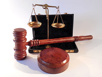 Wooden Gavel and Brass Scales of Justice on White Background