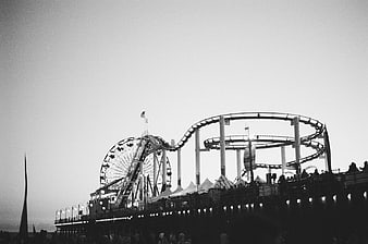 Black and white silhouette of Santa Monica Pier amusement park rides