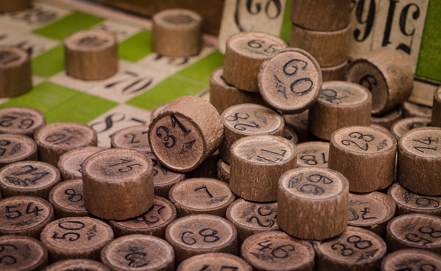 Wooden Bingo Chips Scattered on Game Board