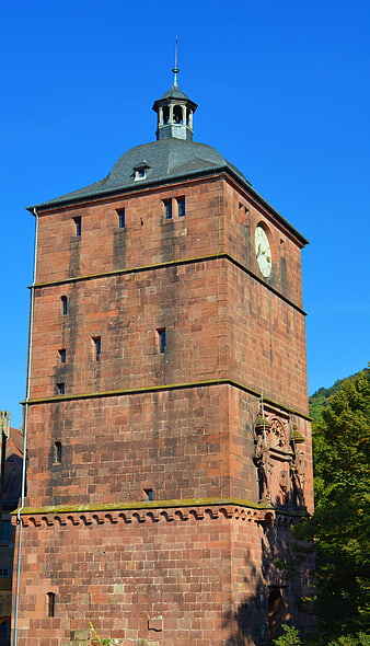 Historic Red Sandstone Clock Tower in Heidelberg, Germany