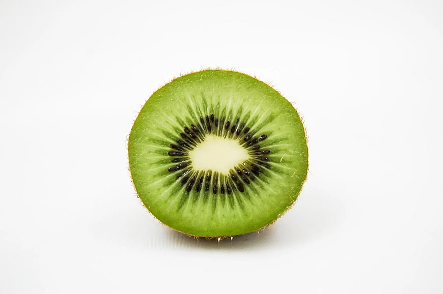 Fresh Sliced Green Kiwi Fruit on White Background