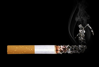Conceptual smoking kills image with grim reaper emerging from burning cigarette