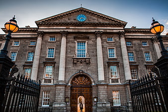Grand Classical University Building with Clock and Iron Gates
