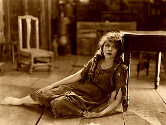 Vintage sepia portrait of distressed woman sitting on floor
