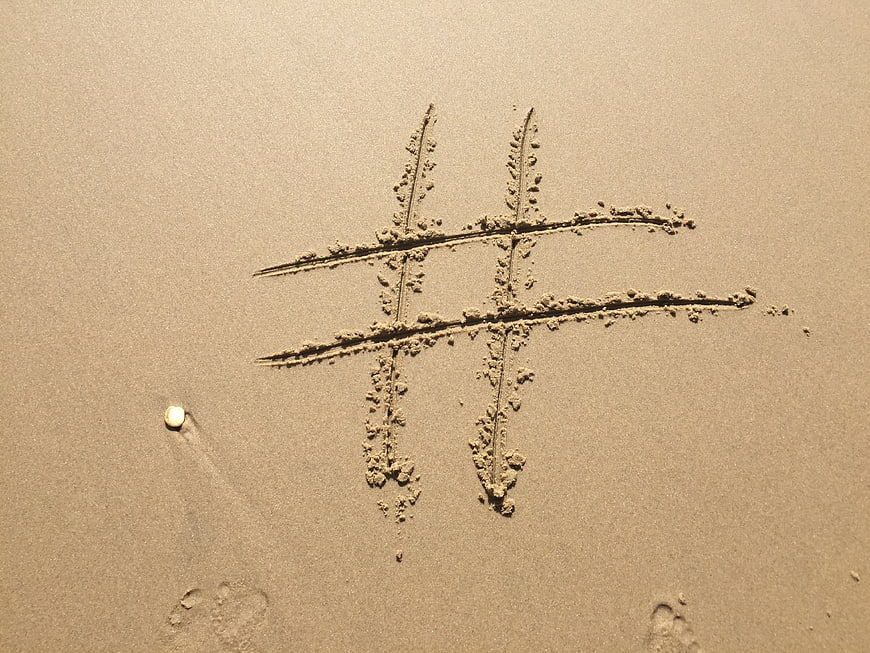 Hashtag Symbol Drawn in Sand on Beach