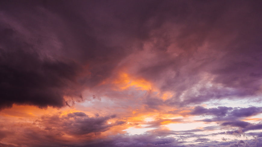 Dramatic Purple and Orange Sunset Sky With Clouds