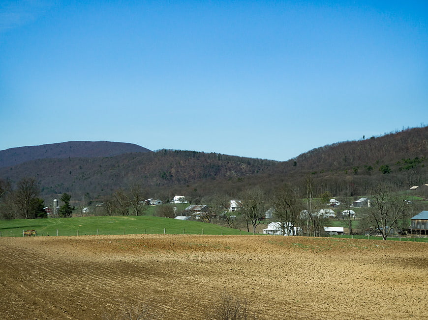 Rural Landscape with Plowed Field and Rolling Hills
