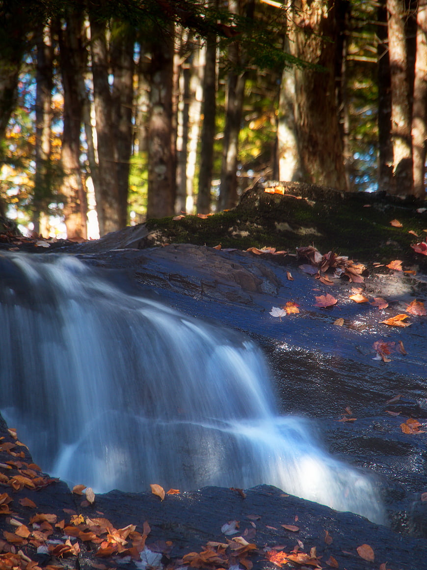 Serene Autumn Waterfall in Forest with Long Exposure
