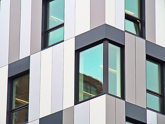 Modern geometric building facade with glass windows