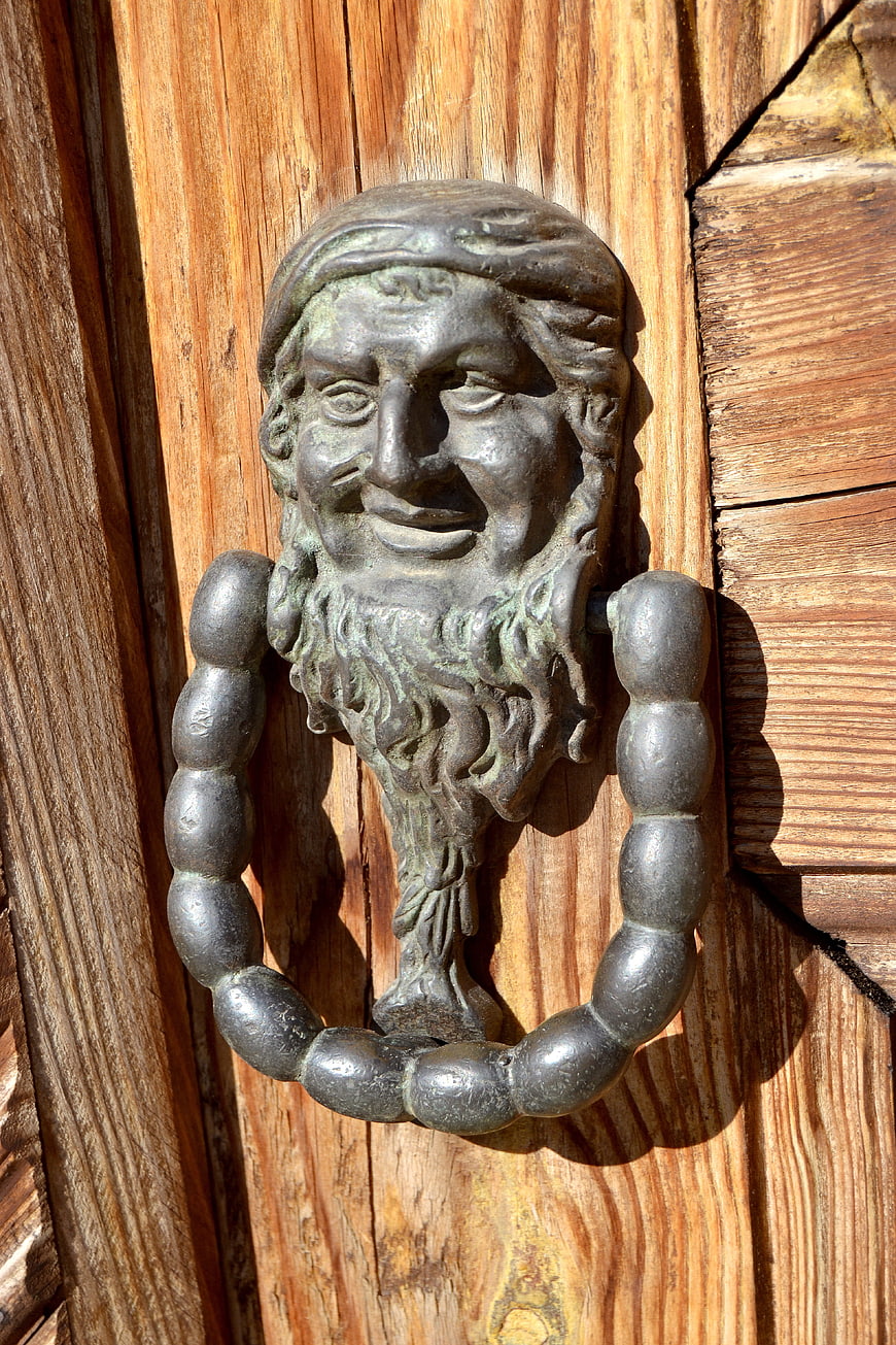 Vintage Bronze Door Knocker on Wooden Door