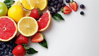 Fresh Citrus and Berries Flat Lay on White Background