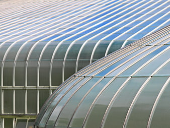 Modern curved glass greenhouse roof architecture detail