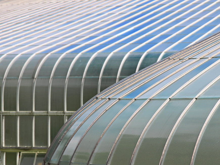 Modern curved glass greenhouse roof architecture detail