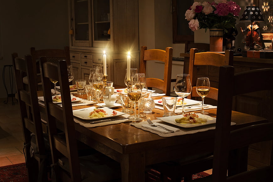 Candlelit Dinner Table Setting with Wine and Appetizers