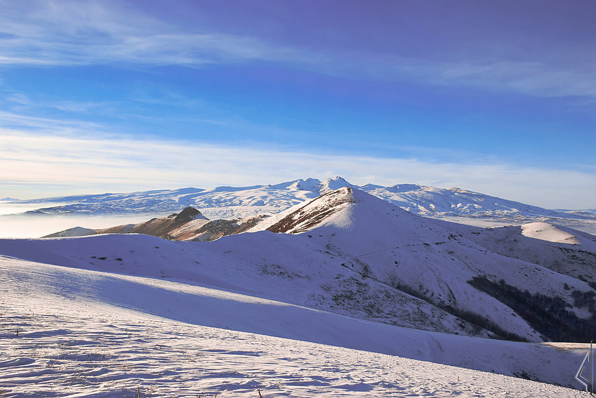 Snowy Mountain Landscape with Blue Sky and Clouds