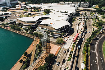 Aerial view of modern curved architecture by the sea