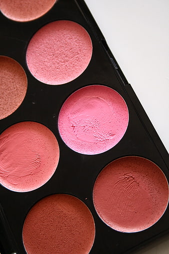 Close-up of cream blush palette with swatches