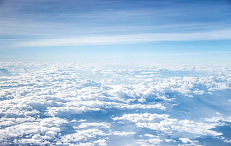 Aerial View of Fluffy White Clouds in Blue Sky
