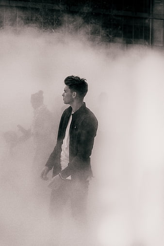 Man in Jacket Standing in Thick Fog