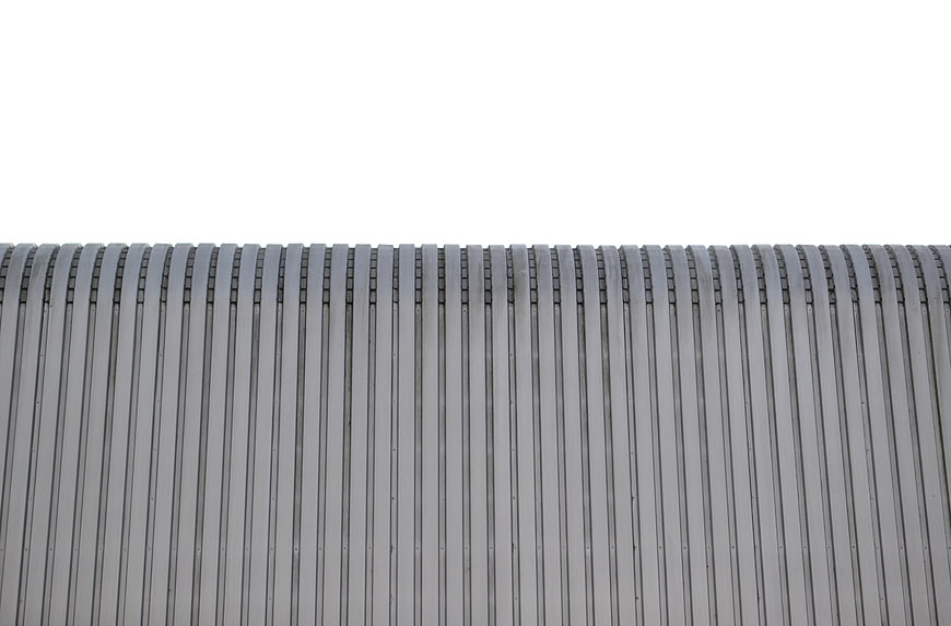Gray corrugated metal roof texture with white background