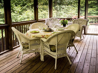 Wicker Dining Set on Screened Porch with Floral Tablecloth