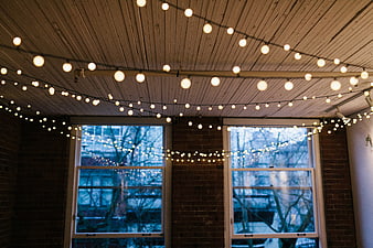 Cozy Interior with String Lights and Brick Walls
