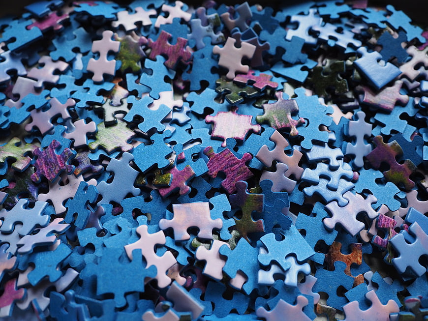 Scattered Blue Jigsaw Puzzle Pieces Close Up