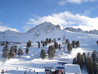 Sunny Winter Ski Resort with Snowy Mountains and Lift