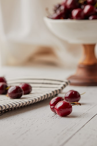 Fresh Red Cherries on Rustic White Wooden Table